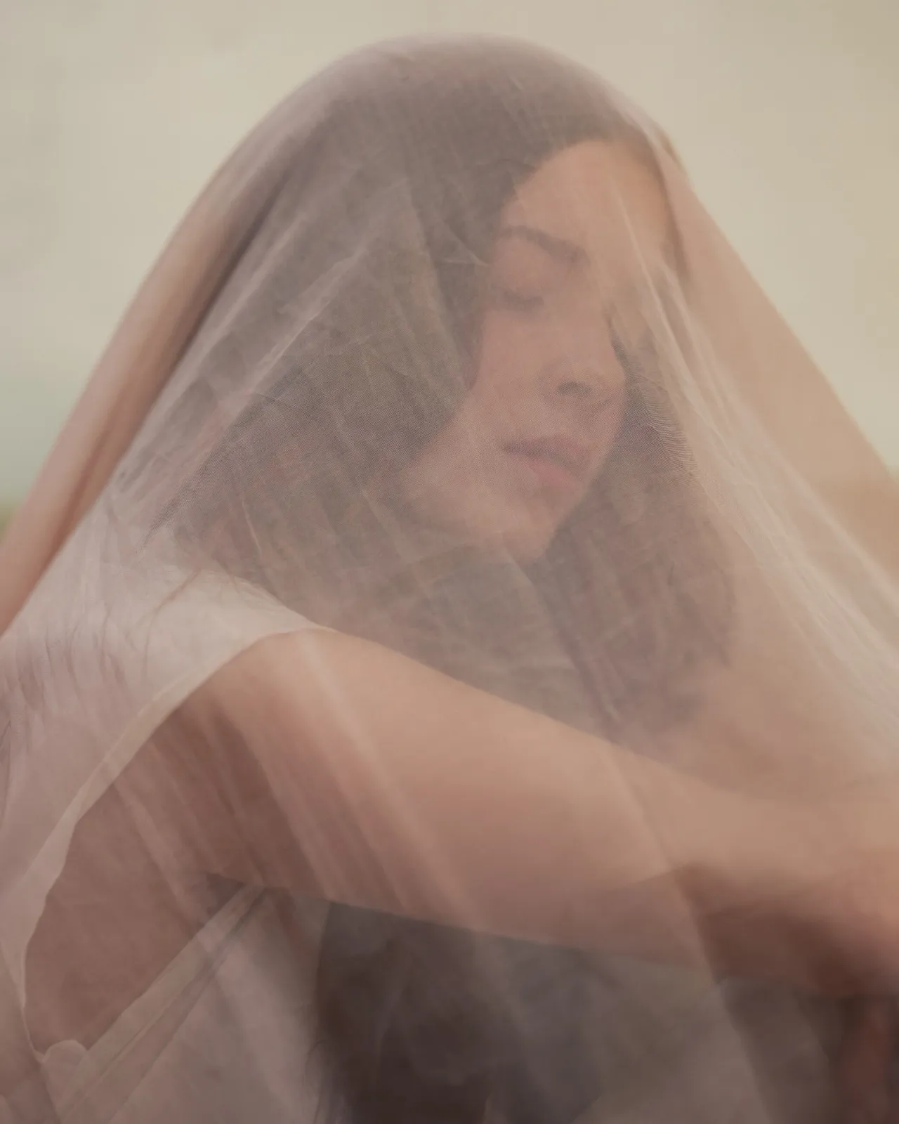 Daniela beneath a rose-coloured veil